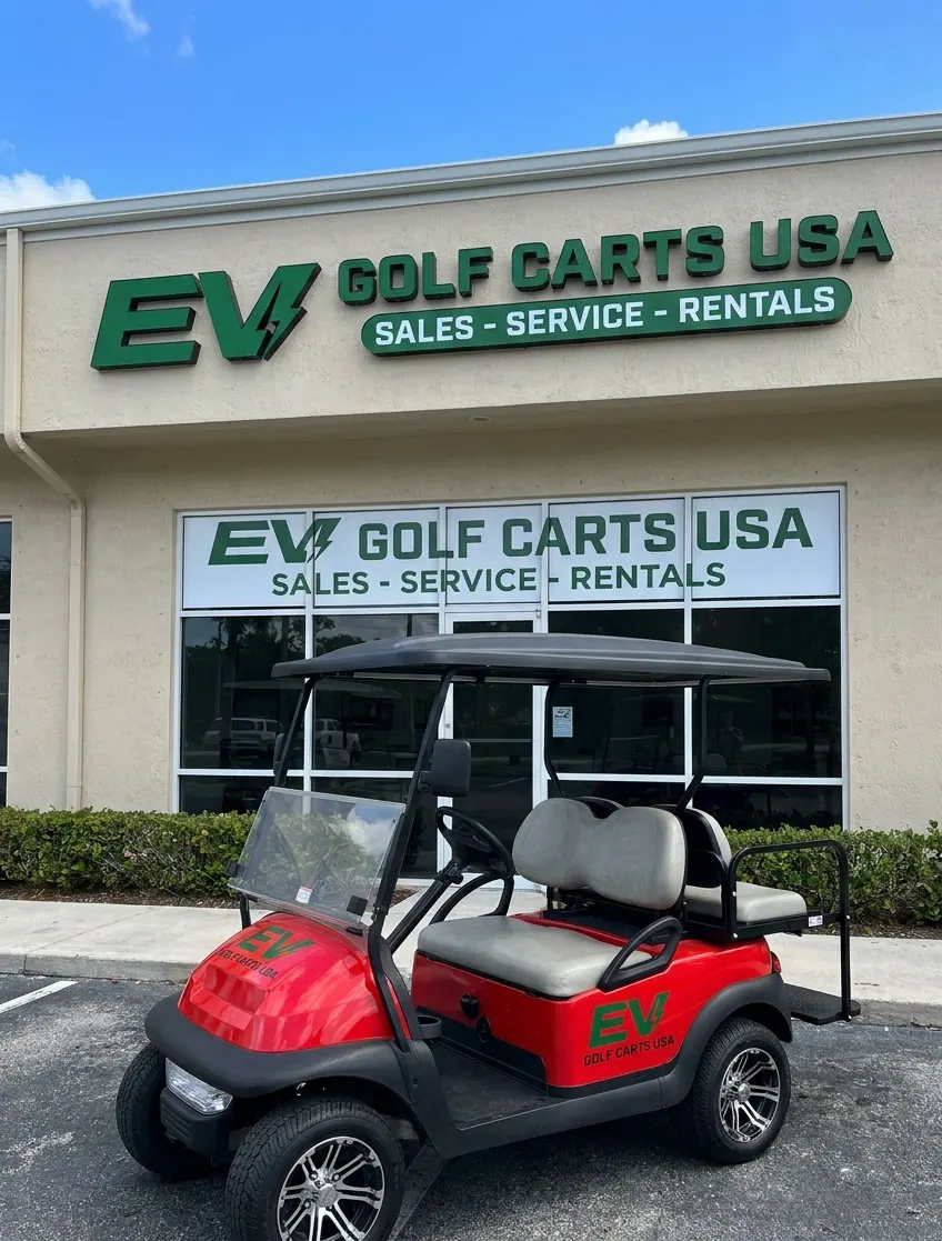 EV Golf Carts USA storefront with a red golf cart parked out front