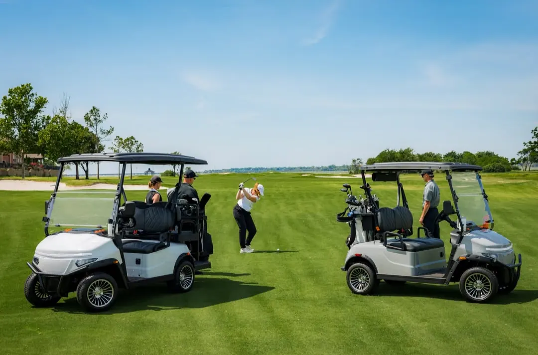 Two EV Golf Carts USA golf carts on a golf course fairway with golfers