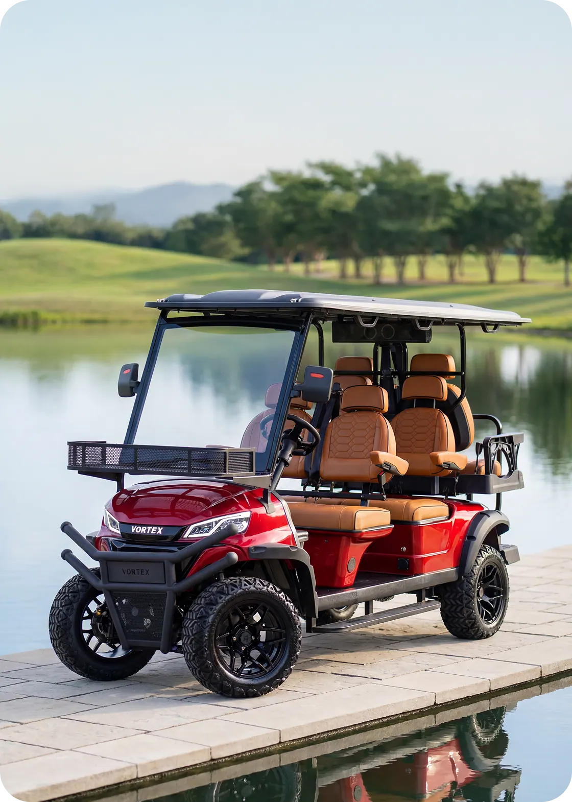 A red six-seater golf cart on a lakeside dock